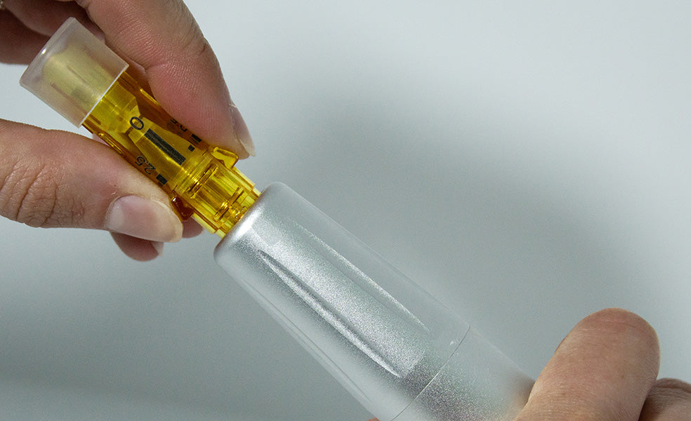 MDerma™ cartridge being inserted into hand piece